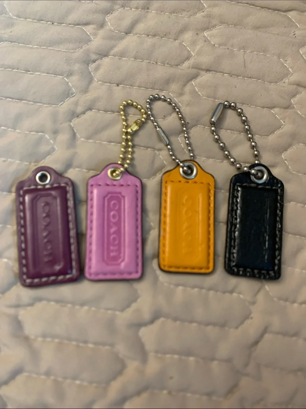 Bundle 4 Coach Leather Mini Tag Keychain Set — Plum, Pink, Mustard, Black